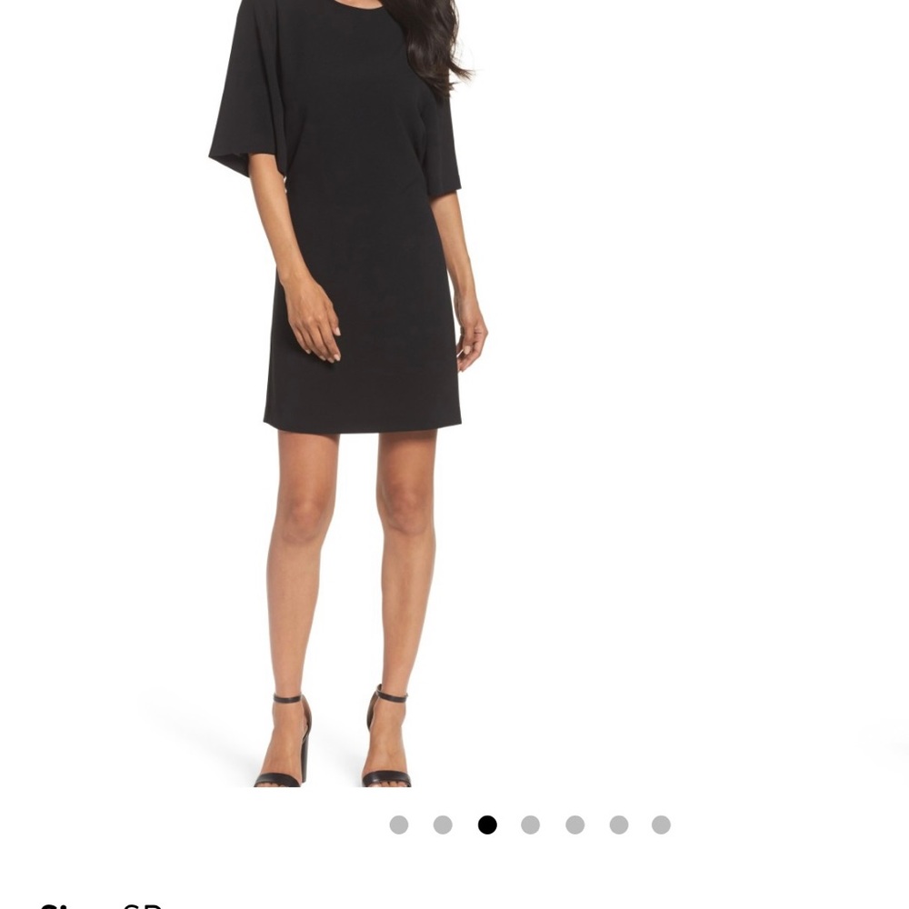 Light and loose shift dress with tie front and flutter sleeves. Black. Size SP.
